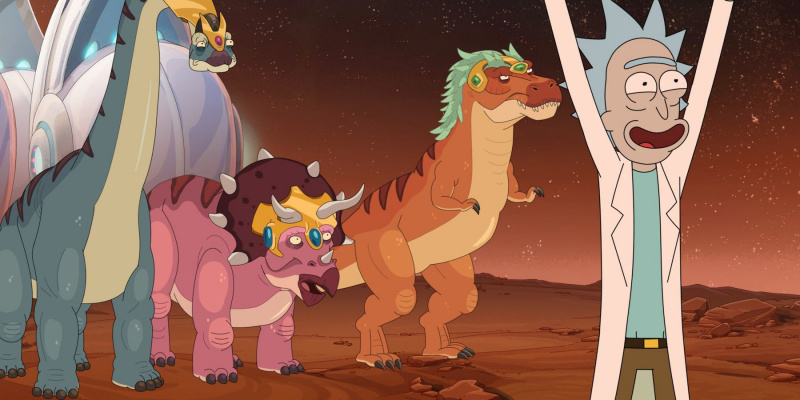   Egy animált, fehér hajú férfi felemelt kézzel áll az animált dinoszauruszok előtt